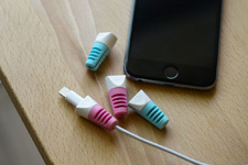 TUDIA Klip on cable next to iPhone