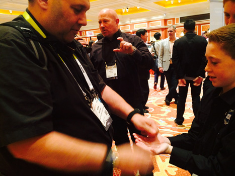 Arlan Levitan Shows Magic Tricks to Rand Peterson at the Kidz Gear Booth at Showstoppers
