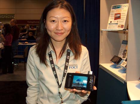 Thomas PR Client Tiffany Guh at the Digital Foci Booth Shows Off their New Picture Porter Elite