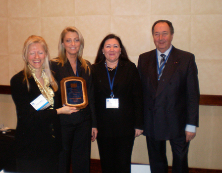 Karen Thomas, Thomas PR, Esmeralda Peleman, Brigitte Peleman, and Mr. Peleman, Peleman Industries win the DIMA Innovative Product Award for Unibind Photos N Sounds at Sneak Peek 2009 at the Renaissance.